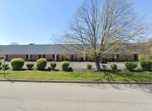 Image of Aeropark exterior and parking lot from street view
